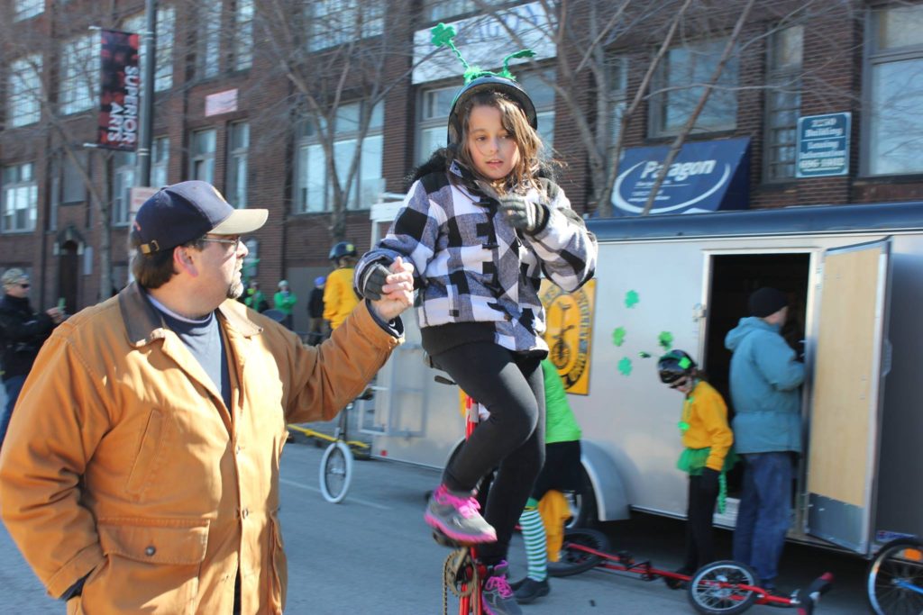 Young unicyclists gets a hand
