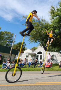 Tall unicyclist in parade